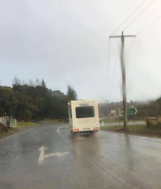 A tourist van photographed on the wrong side of the road near Port Campbell.