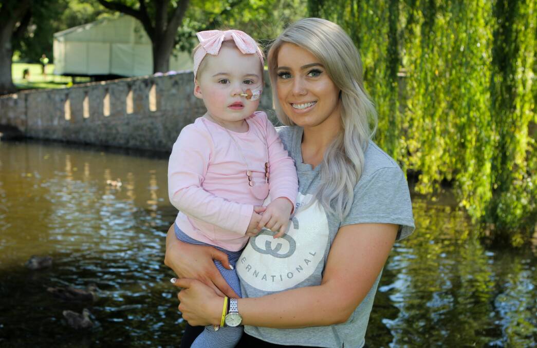 Lexi Davies, 2, and mum Kirrily Payne have some time out in Warrnambool Botanic Gardens feeding the ducks before Lexi's next round of Leukaemia treatment. Picture: Morgan Hancock