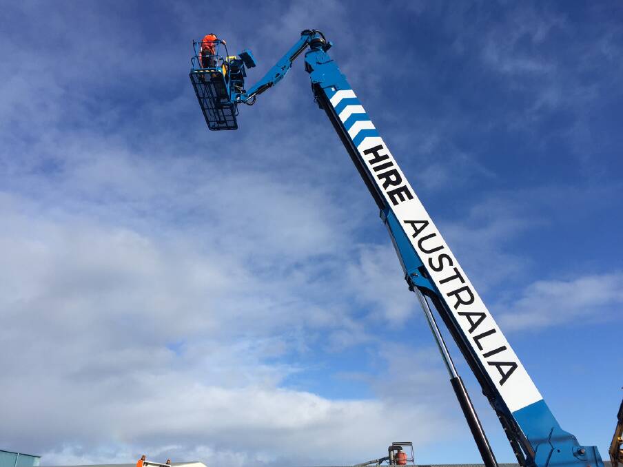 Going up: Chris Dowling heads up in the 60-metre boom lift.