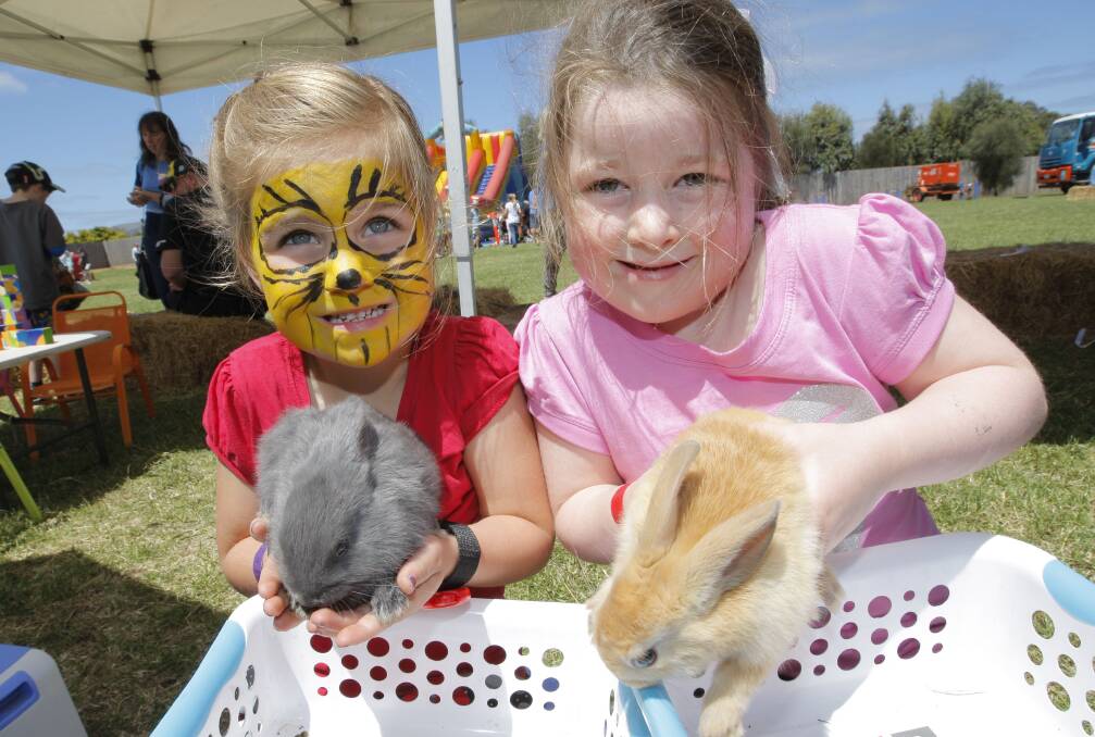 Gennaieve Serra and Dakota Fedley get up close with some rabbits at last year's Dennington Day Out. 