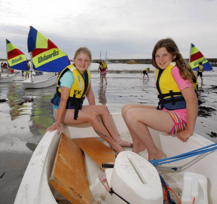 Ready to launch: Koroit and District Primary School pupils Ava Sharman, 11, and Samantha Holland, 10, prepare to head out onto the water for their sailing lesson. Picture: Rob Gunstone