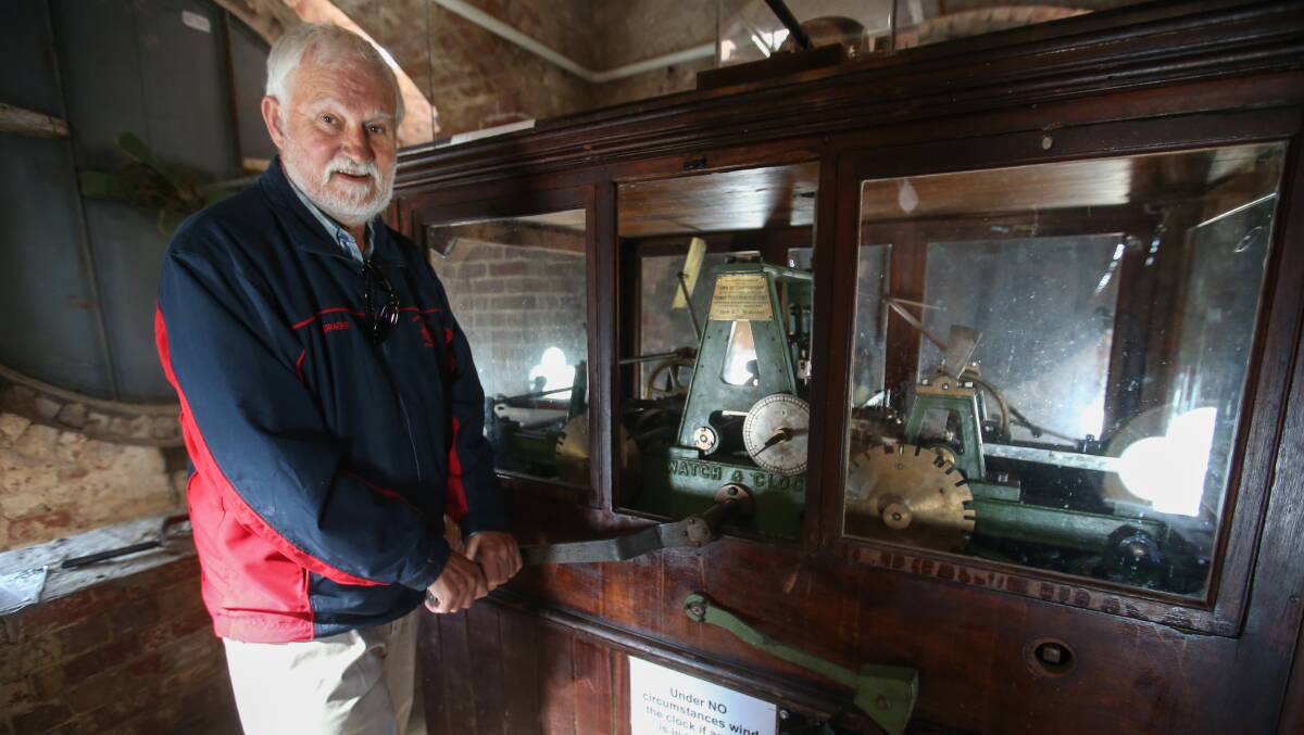 On tour: Rotary Club of Camperdown member Graeme Fischer demonstrates how to manually wind the clock in Camperdown's historic tower, a skill he will demonstrate on group tours. Picture: Amy Paton