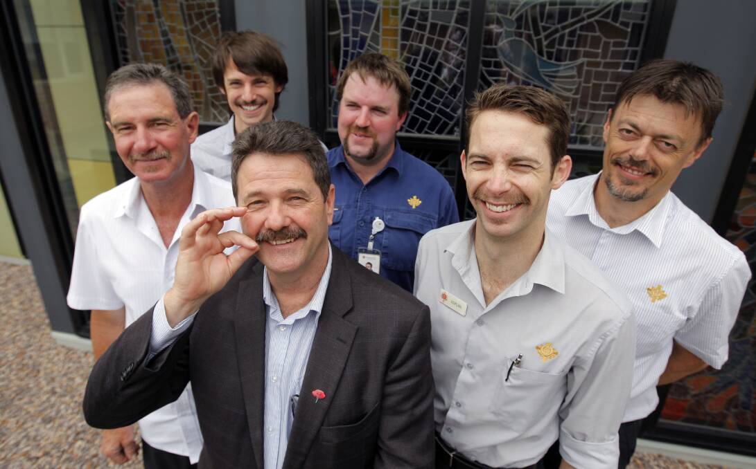 Growing the 'mo: St John of God Movember participants John Boromeo, John Oxford, CEO Trevor Matheson, Brad Smith, Adrian Benson and Mark Powell prepare to have their moustaches shaved off. Picture: Rob Gunstone