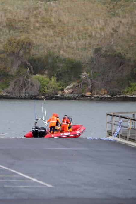 An SES crew searches the Hopkins River on Monday morning. Picture: Amy Paton