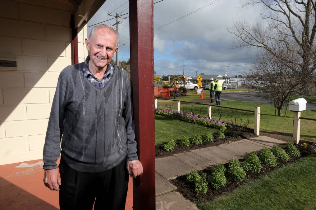 Celebration: Terang's Jim O'Brien watches on as a natural gas pipeline is installed in front of his house after years of campaigning. Picture: Rob Gunstone
