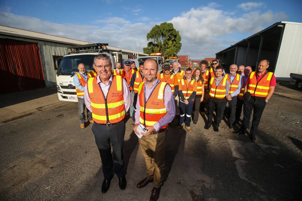VicRoads chief executive John Merritt and regional director Mark Koliba with a works crew in Warrnambool on Thursday. Picture: Amy Paton