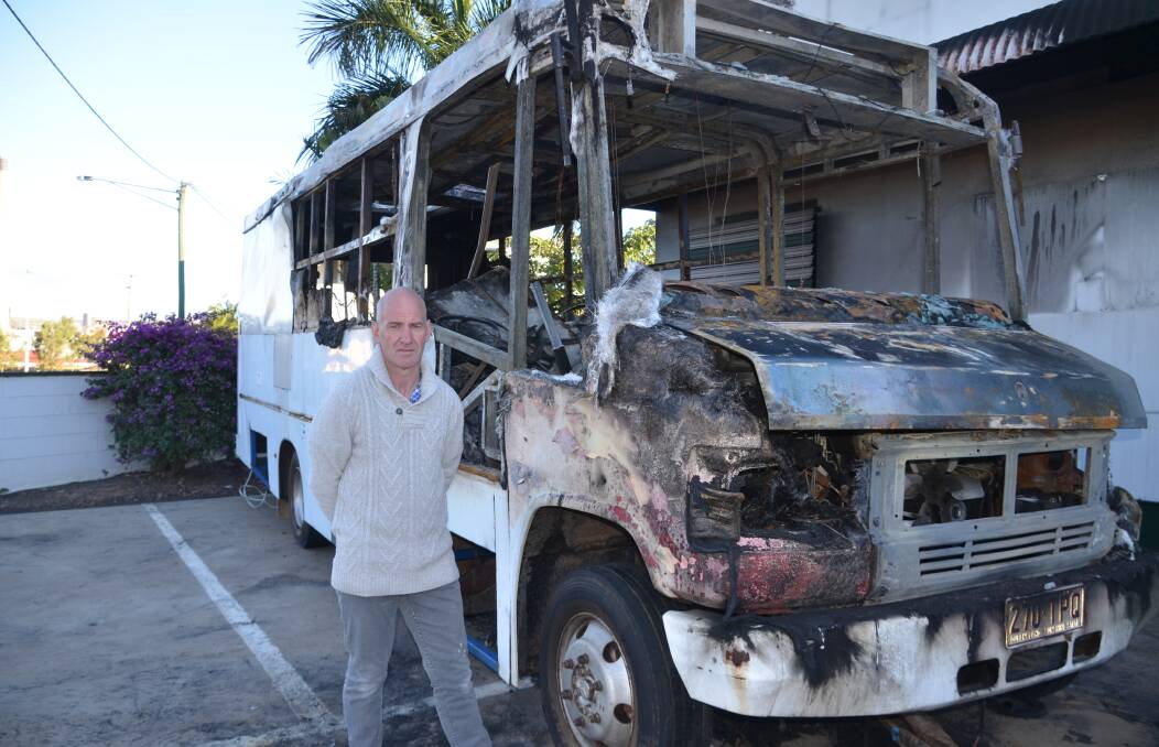 DREAM DESTROYED: Warrnambool man Peter Hargreaves surveys the remains of his burnt-out bus in Mount Isa last week. Picture: Derek Barry