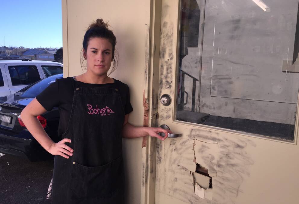 BREAK-IN: Bohemia cafe and bar manager Missy Claridge at the rear door where the offender broke into the cafe on Thursday night, it's the second time it has been burgled. Picture: Anthony Brady