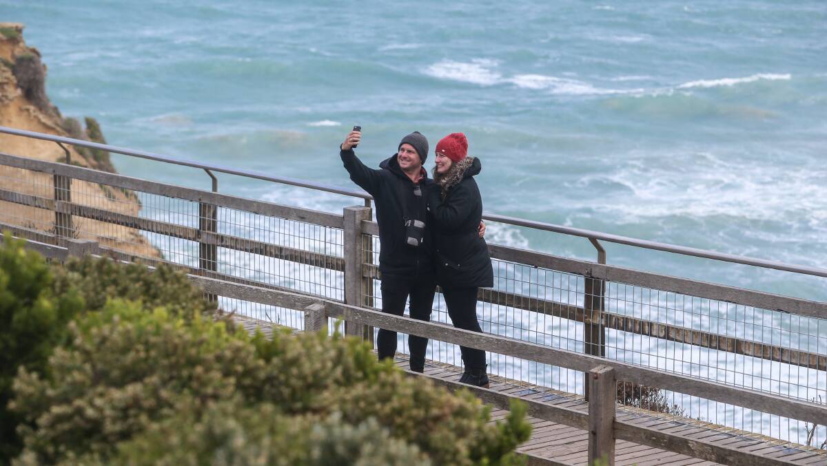 SNAP: Visitors get their selfie with the Twelve Apostles in the background. Picture: Amy Paton