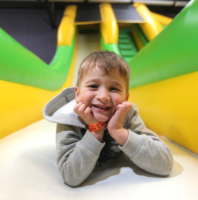 FUN TIME: Anthony Sergakis, 4, from Melbourne took a short break from bouncing around at Warrnambool's Fun4Kids Festival's Inflatable World. Picture: Amy Paton