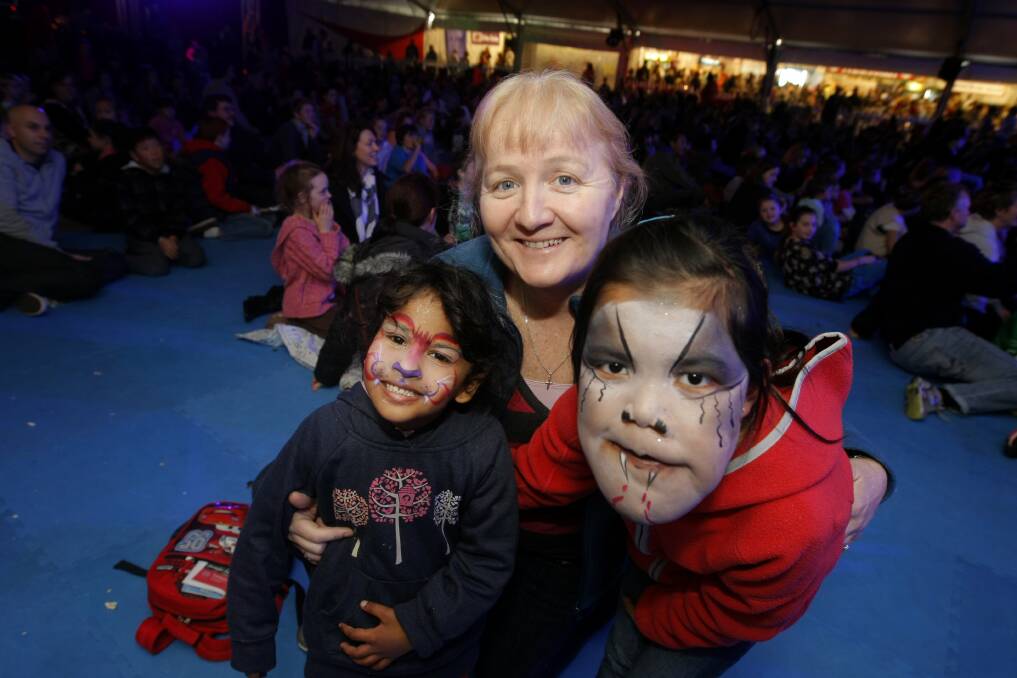 SAD DAY: Trishna Mollik, 5, Victorian of the Year Moira Kelly, and Choekey Tenzin (from Tibet), 8, at the Warrnambool Fun 4 Kids Festival in 2012. Picture: Rob Gunstone