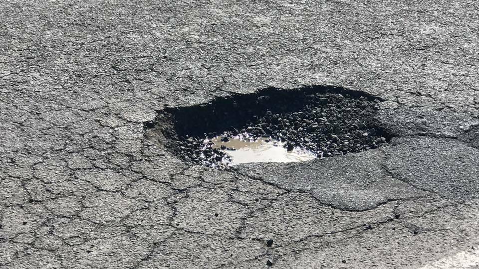 MORE PAIN: A reader supplied this photo of a pothole on Mortlake Road which left her $170 out of pocket. Tyre repair businesses say drivers are angry at the damage.