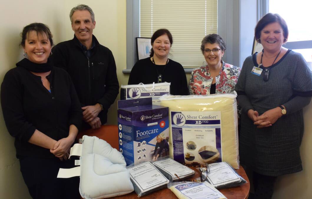 Beneficial: Moyne Health Services district nurses Trudi Baxter and Fabian McLindin, acute nurse unit manager Noelene Joosen, Peter's Project founder Vicki Jellie and MHS acting executive director of community services Glynis Dean with the donated pressure relieving equipment. Picture: Madeleine McNeil