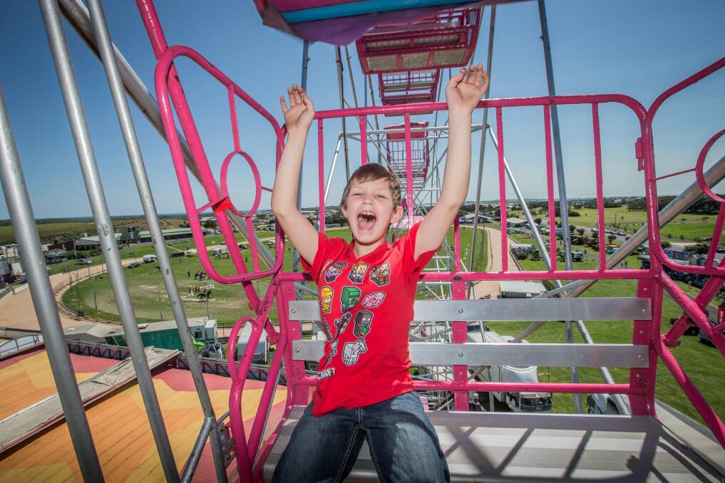 Happy: Ride reviewer Jordan Marcos, 8, enjoyed going on the ferris wheel and the views overlooking Warrnambool. The show continues on Saturday and Sunday. Picture: Christine Ansorge