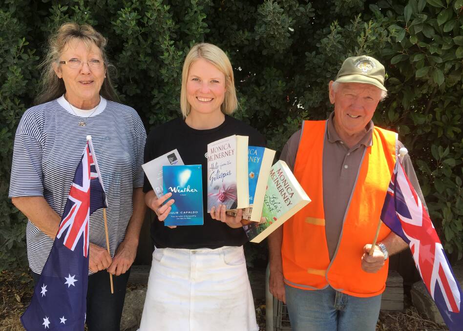 Book sale: Lifeline fundraising and sustainability manager Bess Slater (centre) with volunteers Diane O'Connor and Brian Douglas prepare for the Lifeline Australia Day Long Weekend Book Fair in Port Fairy. Picture: Madeleine McNeil