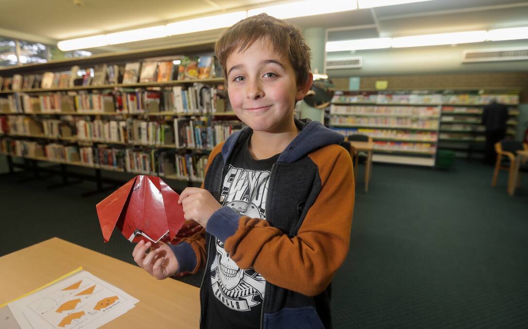 Folding fun: Jacob King, 9, of Portland was one of the children who embraced a school holiday origami session at the Warrnambool library. The activity runs each day of the holidays. Picture: Morgan Hancock