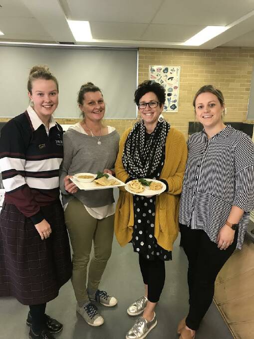 Satisfied: Mercy Regional College student Chey Beaver, 18 and staff members Berni Sinnott, Claire Walsh and Caitlin Rix have lived on rations for the past week.

