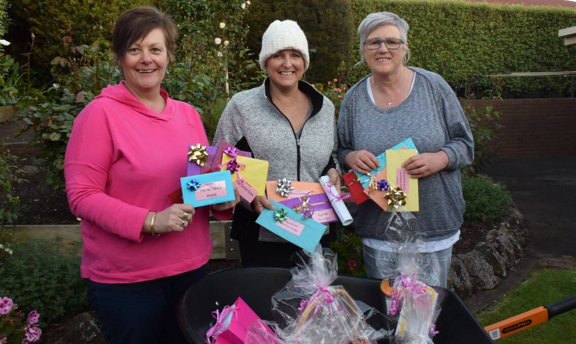 Ruth McLeod (left) and Jane Murphy (right) have organised a movie fundraiser for their friend of 30 years Liz Salathiel (centre) who was diagnosed with stage three breast cancer in June. Picture: Madeleine McNeil
