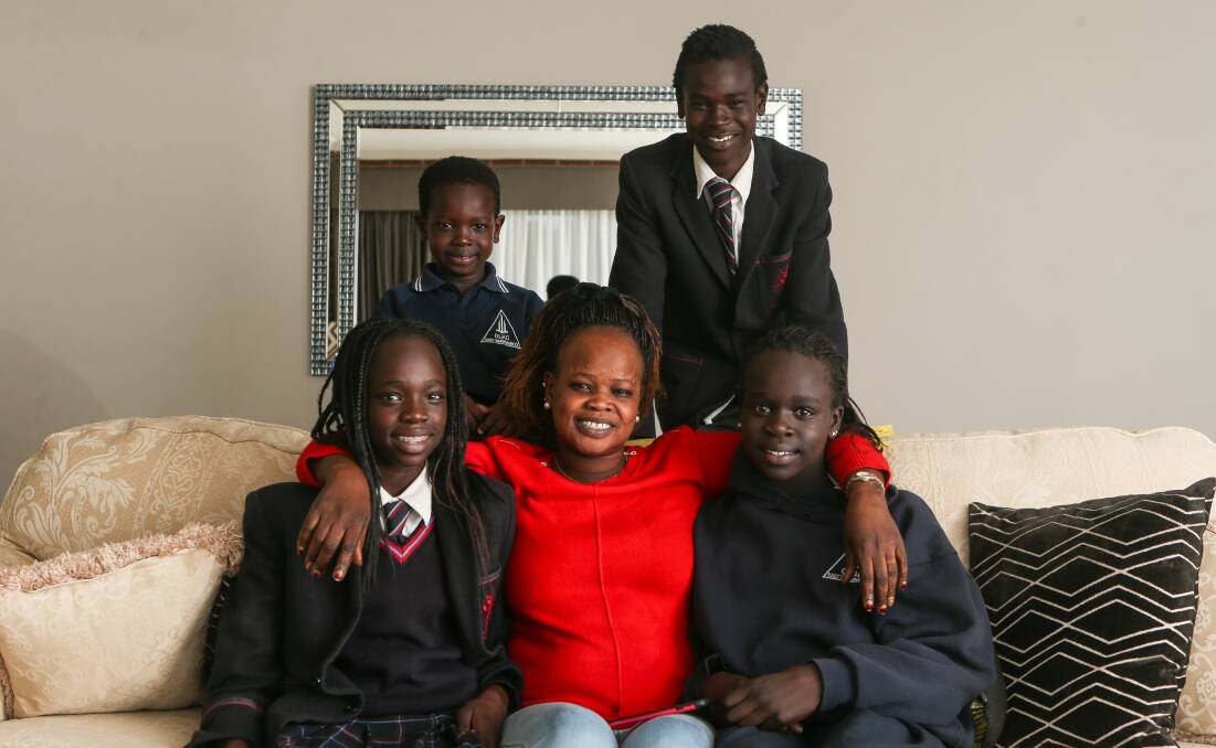 Matriarch: Teresa Padiet wants to give her children Daniella Ajang, 14, Evans, 5, Emmanuel, 15, Ywomo, 11, and Berjitta, 18, (not pictured) the education she didn't have so they can go onto achieve. Picture: Amy Paton