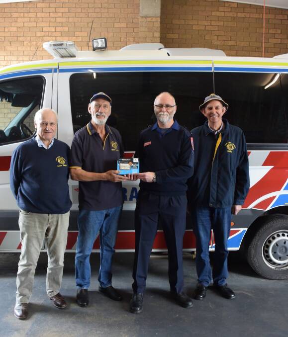  Clear direction: Port Fairy Belfast Lions Club president Keith Gibson, member Gray Wilson, membership chairman Henry Toller-Bond (left) with Port Fairy ambulance acting team manager Mike Cornett. Picture: Madeleine McNeil
