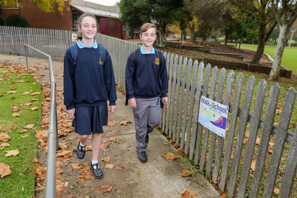 Active: St Joseph's Primary School students Caity O'Leary, 11, and Charlie Hughes, 10, put their best foot forward at a Walk to School event earlier this year. Picture: Rob Gunstone