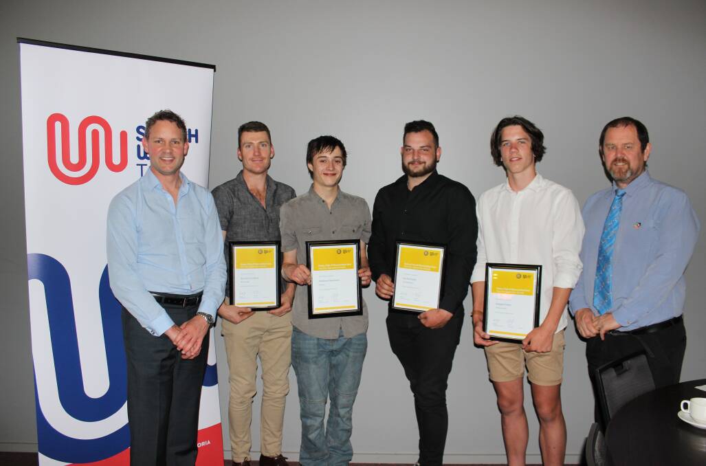 Honour: South West TAFE chief Mark Fidge, with Rotary Club of Warrnambool East First Year Apprentice Award winner Matthew Rawlinson (third from left) with Brendan Chatfield (second from left), Kel Archbold, Keegan Picken and Warrnambool East Rotary Club president Mark Taylor.