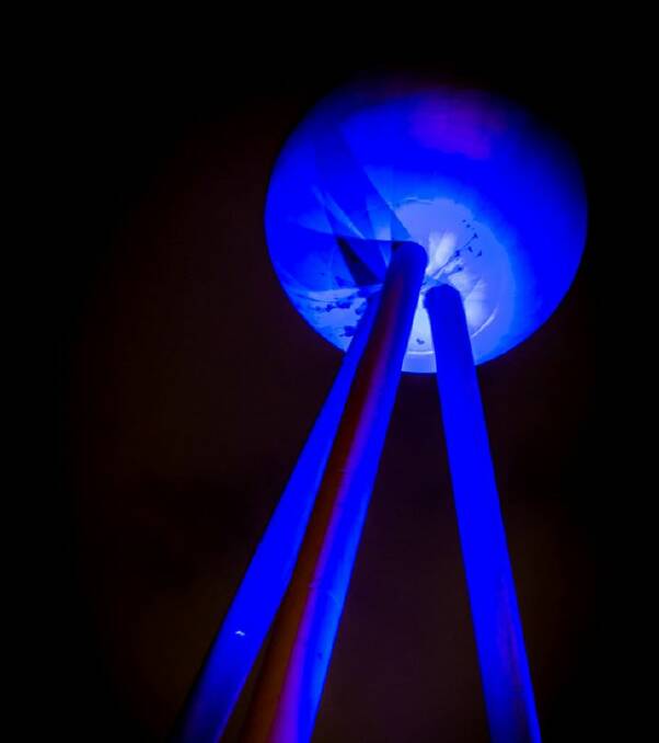 Shine bright: The Fletcher Jones Silver Ball will be illuminated at night. It has been lit up in blue in the past (above) to raise autism awareness. Picture: Rhonda McDonell