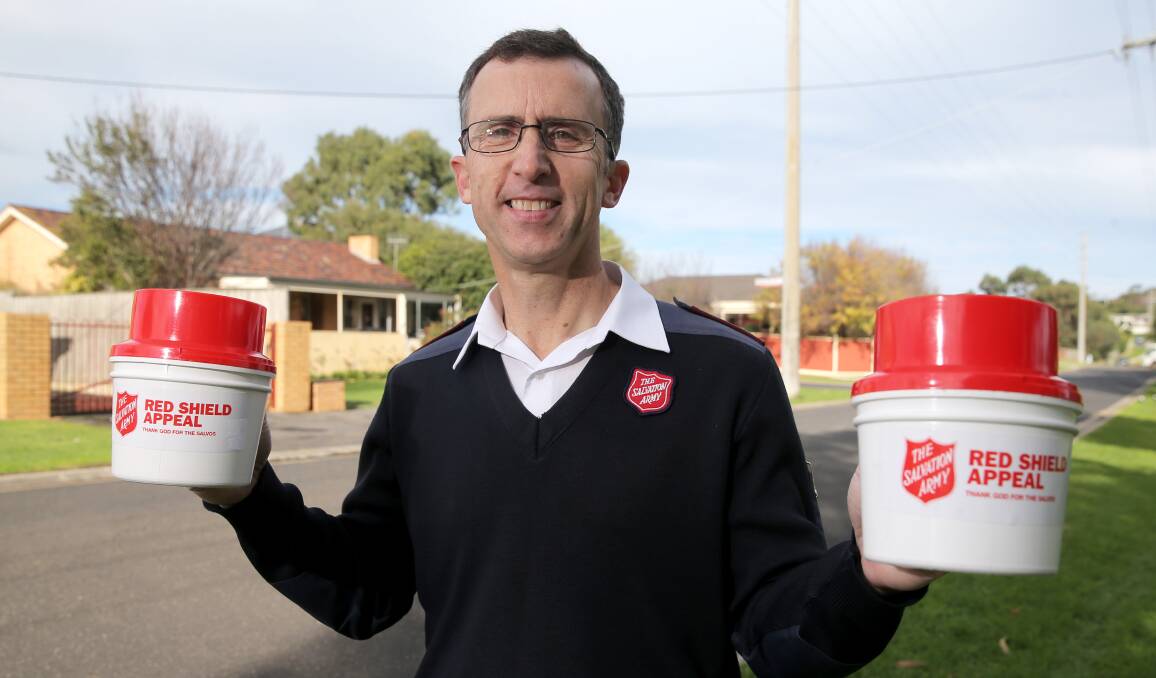 Collecting: Salvation Army Warrnambool corps officer Major Peter Wood promotes the Red Shield Appeal which runs until June 5. Picture: Rob Gunstone
