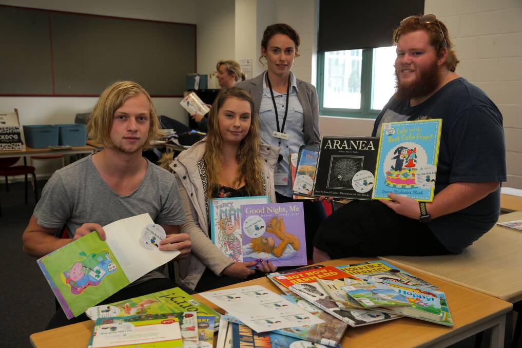 Storytime: South West TAFE VCAL students Callan Hadfield, 16, Felicity Went, 18, Warrnambool City Council's Kat Blake and Bray Forde, 17, sort books for The Little Book Bug boxes. Picture: Rob Gunstone