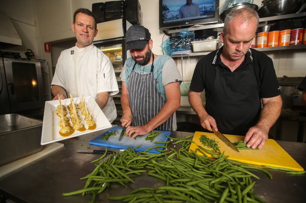 Ready: King's Catering owner and chef Robert King and kitchen hands Andy Graham and David Stevenson work to prepare some of the thousands of dishes to be served at the May Races. Picture: Amy Paton