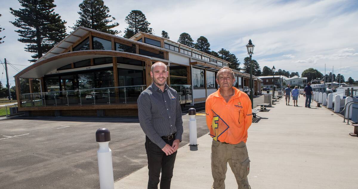 Done and dusted: Fairbrother Construction project manager Aaron Finnigan and foreman Tony Sharam outside Port Fairy's new wharf building. Picture: Christine Ansorge