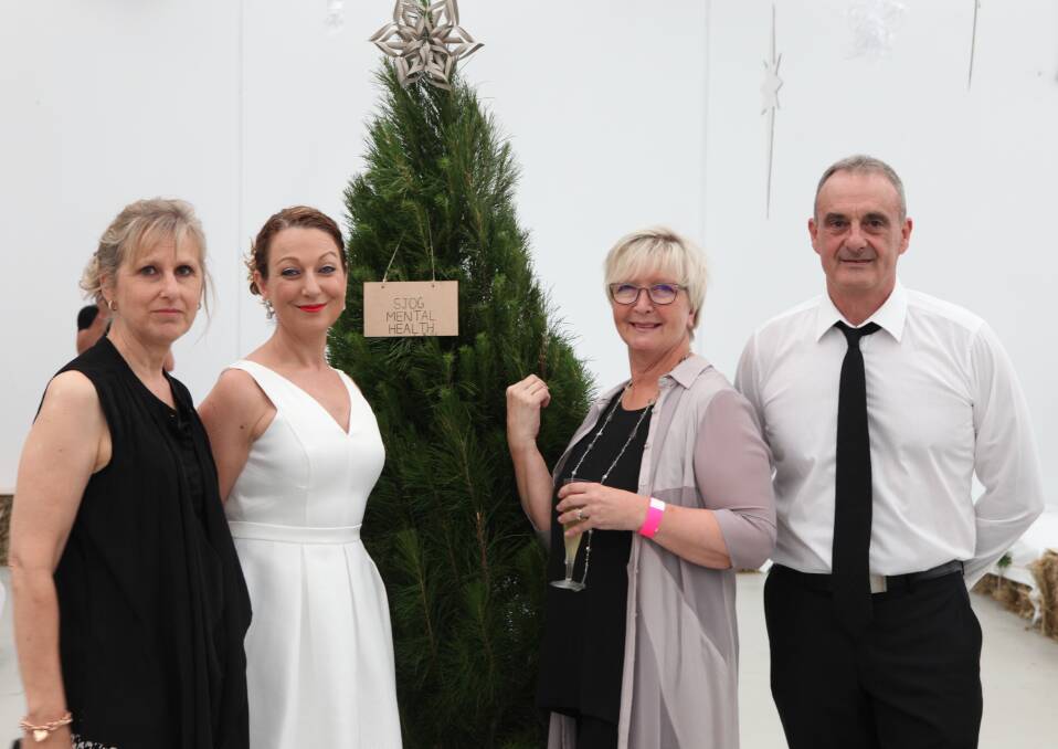 Christmas cheer: Beth Carty, Jodie Fleming and Deb and John Parkinson at last year's Leila Rose Foundation Rare White Christmas Ball. 