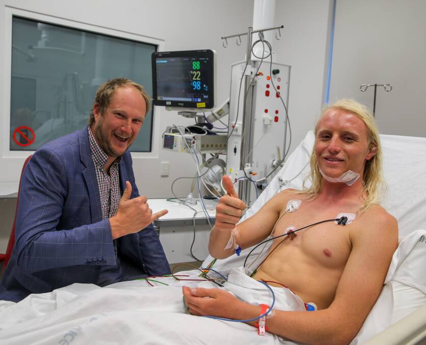 Alive: Moyne Shire councillor and Port Fairy surfer Jordan Lockett with professional surfer Russell Bierke who almost drowned in Port Campbell. Picture: Rob Gunstone