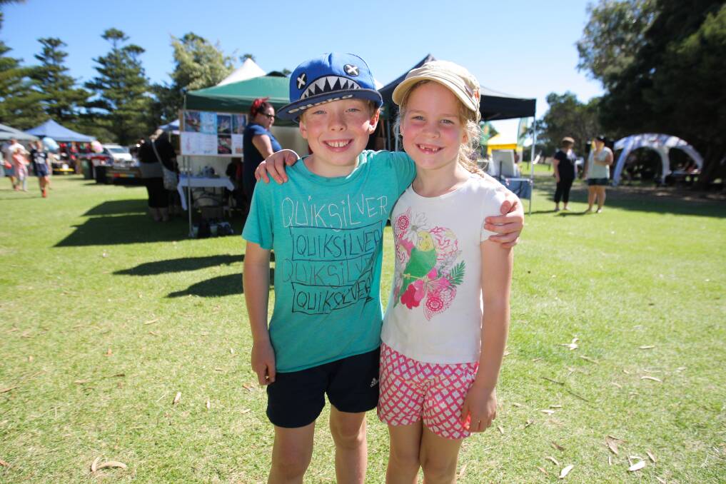 Holidays: Marshall Sloane, 9, and Scarlett Sloane, 7, at Warrnambool's Summer Night Markets which include live music, various stalls and an array of foods, boutique beer and wine to enjoy on the banks of Lake Pertobe.