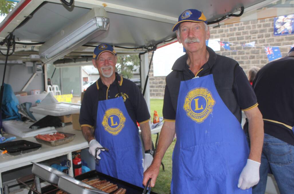Cooking up a storm: Port Fairy Belfast Lions Club members Geoff Scott and Gray Wilson at the 2015 Australia Day ceremony. Members are preparing for the annual cup eve dinner on Monday. Picture: Anthony Brady