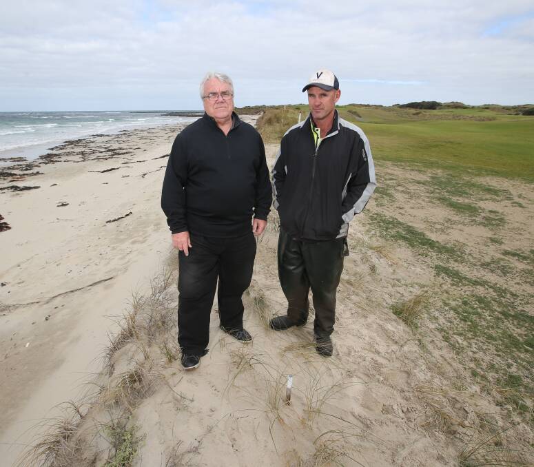 Going: Port Fairy Golf Club manager Barry Dodd and course superintendent Troy Richardson stand between the beach and the golf course. They are considering long-term options to protect the course. Picture: Amy Paton