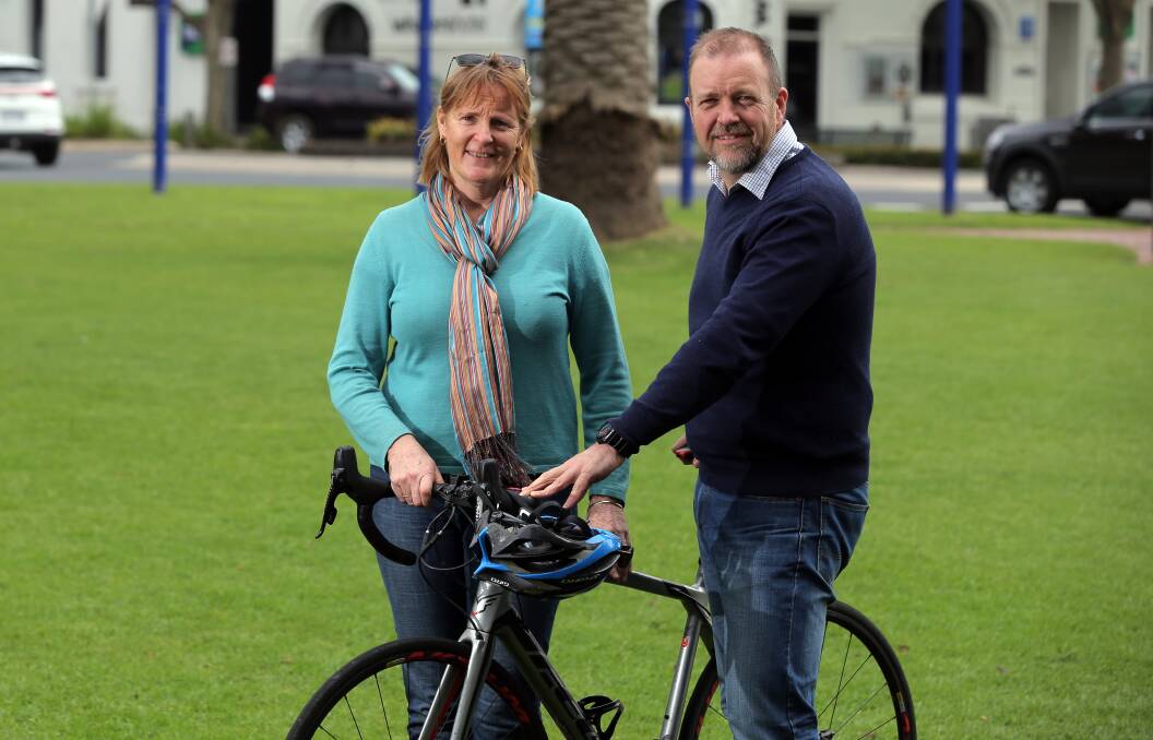   Riding high: Active Hub organising committee members Clare Vaughan and Richard Adams encourage residents to attend Sunday's activities. Picture: Rob Gunstone