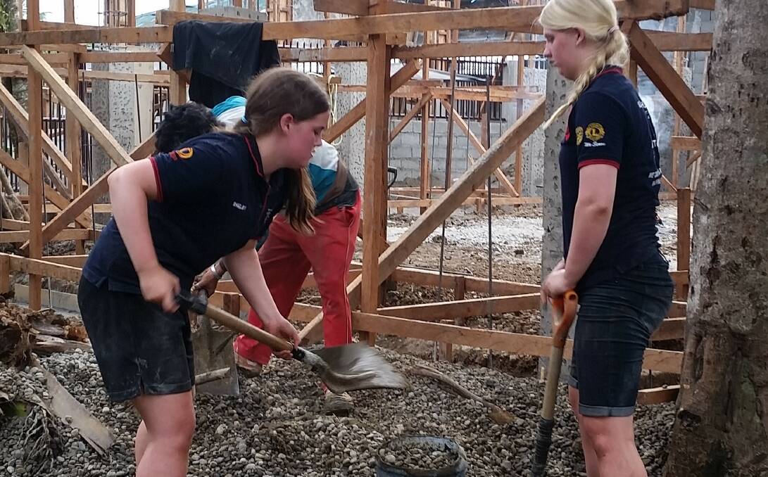 Construction: South-west teens Shelby Jenkins and Phoebe Cody participate in the Alternative to Schoolies program in November last year.