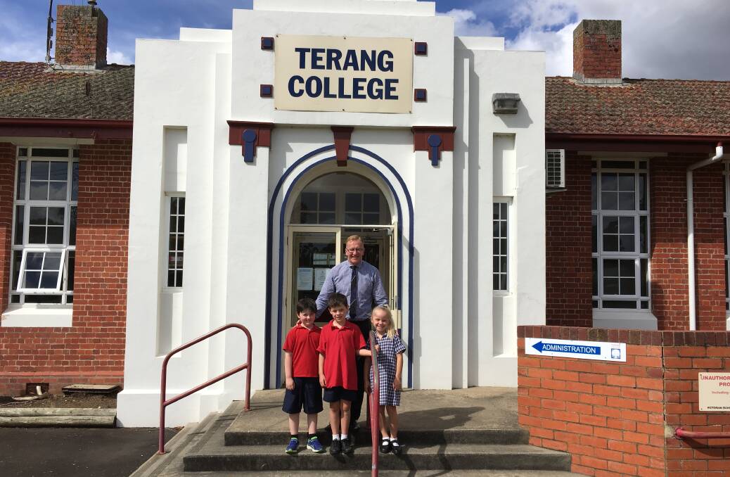 End of an era: Terang College assistant principal Kerrin McKenzie with students (l-r) Ben Rollo, 6, Jasper Fraser and Tayla Bell, both 7. Picture: Madeleine McNeil
