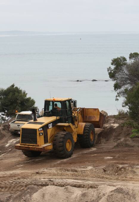 Rockin' it: Construction is under way on an East Beach rock wall. Council is also completing revegetation works at the car park while onsite. Picture: Angela Milne.