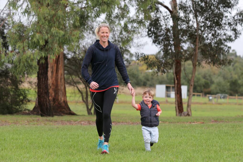 Ready to go: Terang's Faye Clarke prepares for the Mother's Day Classic on May 8, with the help of her son Zac, 2. Picture: Rob Gunstone