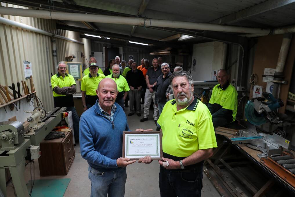 Handy: Port Fairy Folk Festival president John Young with Port Fairy Men's Shed president Peter Down in the refurbished shed which was made possible thanks to a $3,100 festival grant. Picture: Rob Gunstone