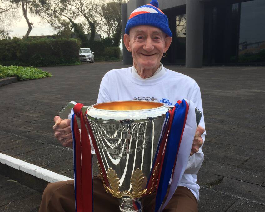 WORTH THE WAIT: Western Bulldogs fan Garry Hincks, of Portland, got his hands on the 2016 premiership cup on Friday. Mr Hincks watched the Dogs end their 62-year drought at the MCG last weekend.
