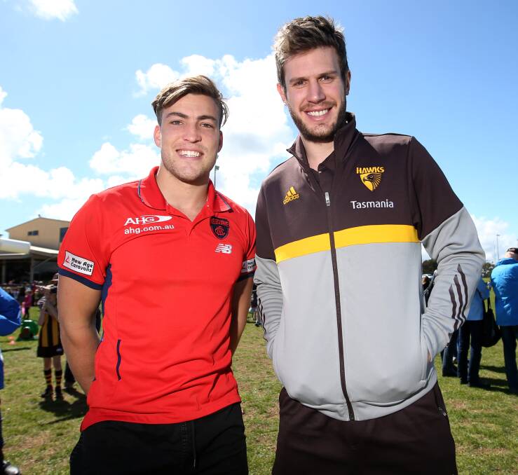 STARS IN TOWN: Melbourne midfielder Jack Viney and Hawthorn defender Grant Birchell visited Warrnambool for its free football festival on Friday. Picture: Amy Paton