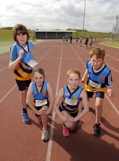 MELBOURNE-BOUND: Warrnambool Little Athletics Club's Quaid Hinkley, 11, Paige Ellwood, 9, Grace Kelly, 9, and Harry Perrett, 11, are ready to compete in the relay events at the state titles. Picture: Rob Gunstone