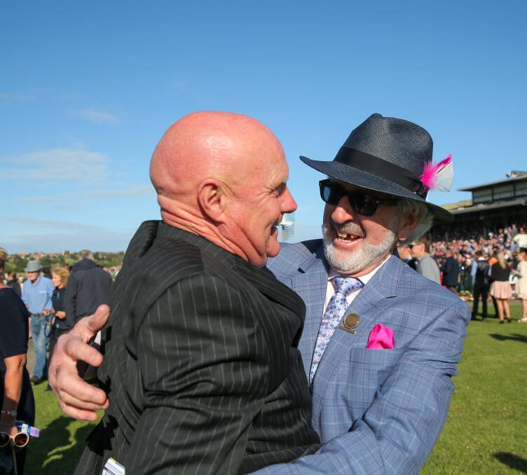 CHUFFED: Regina Coeli co-owners Colin McKenna and John Maher embraced after the mighty mare won the Grand Annual Steeplechase for a second time on Thursday. Pictures: Rob Gunstone