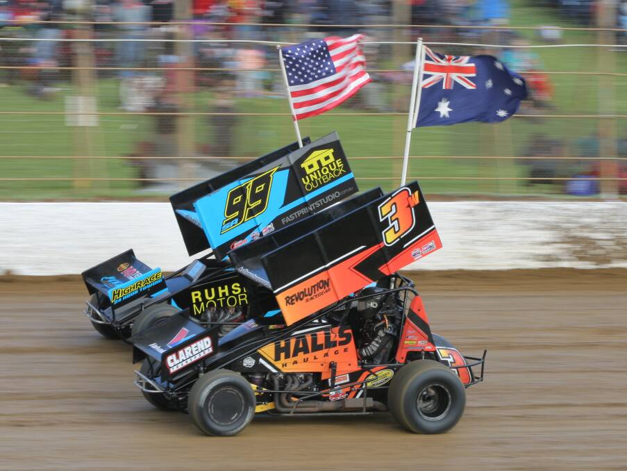 FLYING THE FLAG: American Brad Sweet and Australian Steven Lines pace around the track during the national anthem formalities on Friday night.