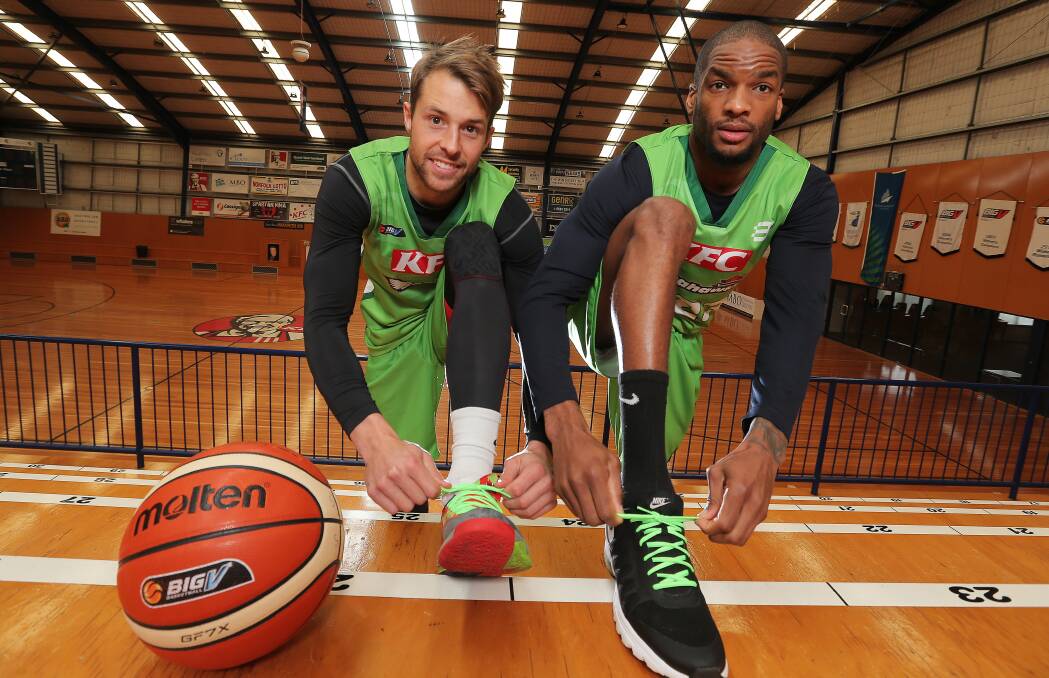 GREEN MACHINE: Warrnambool Seahawks' Nathan Sobey and Xavier Johnson-Blount are throwing their support behind muscular dystrophy awareness. Picture: Rob Gunstone