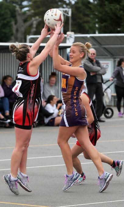 TOO CLOSE TO CALL: Koroit coach Jacqui Bowman and Port Fairy midcourter Sarah McCorkell battle for possession during their Hampden league draw. Picture: Rob Gunstone