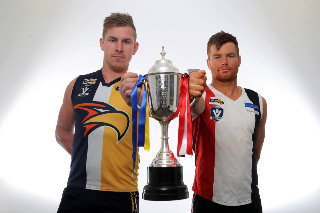 HOLY GRAIL: North Warrnambool Eagles captain Rory Taggert and his Koroit counterpart Isaac Templeton want to hold the Hampden league premiership cup aloft on Saturday. Picture: Rob Gunstone